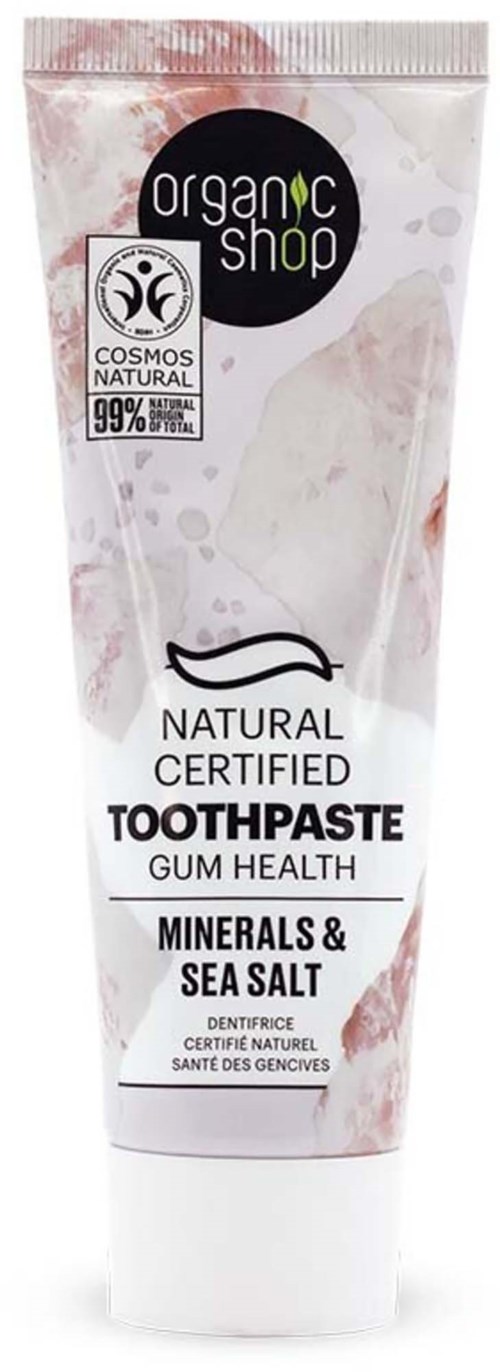 En tub med ekologisk tandkräm märkt för tandhälsa med havssalt och mineraler, certifierad naturlig, 99 % naturliga ingredienser.