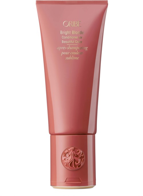 En rosa tub Oribe Bright Blonde Conditioner med dekorativt lock och guldtextetikett.