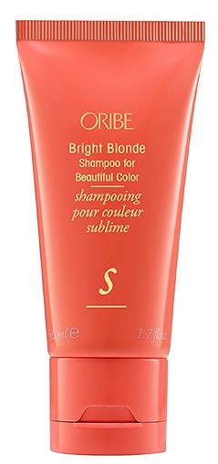 Ljust orange tub med Oribe-schampo för blont hår med guld- och vit text.