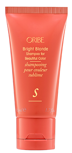 Orange tub med Oribe Bright Blonde Shampoo för vackert, glänsande blont hår.