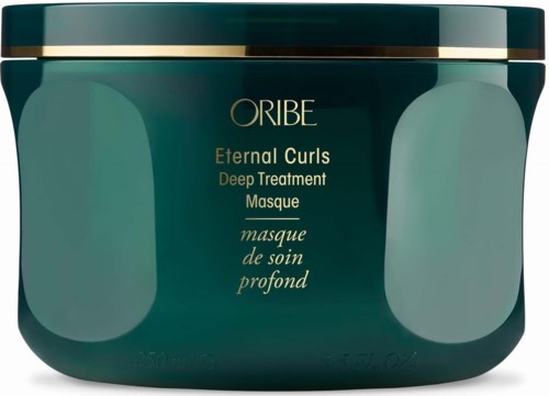 En mørkegrønn krukke med gulllinjer, merket 'Oribe Eternal Curls Deep Treatment Masque' for hårpleie.