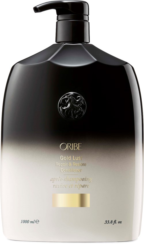 En svart og gull sjampo flaske med pumpe, merket "ORIBE Gold Lust Repair & Restore".