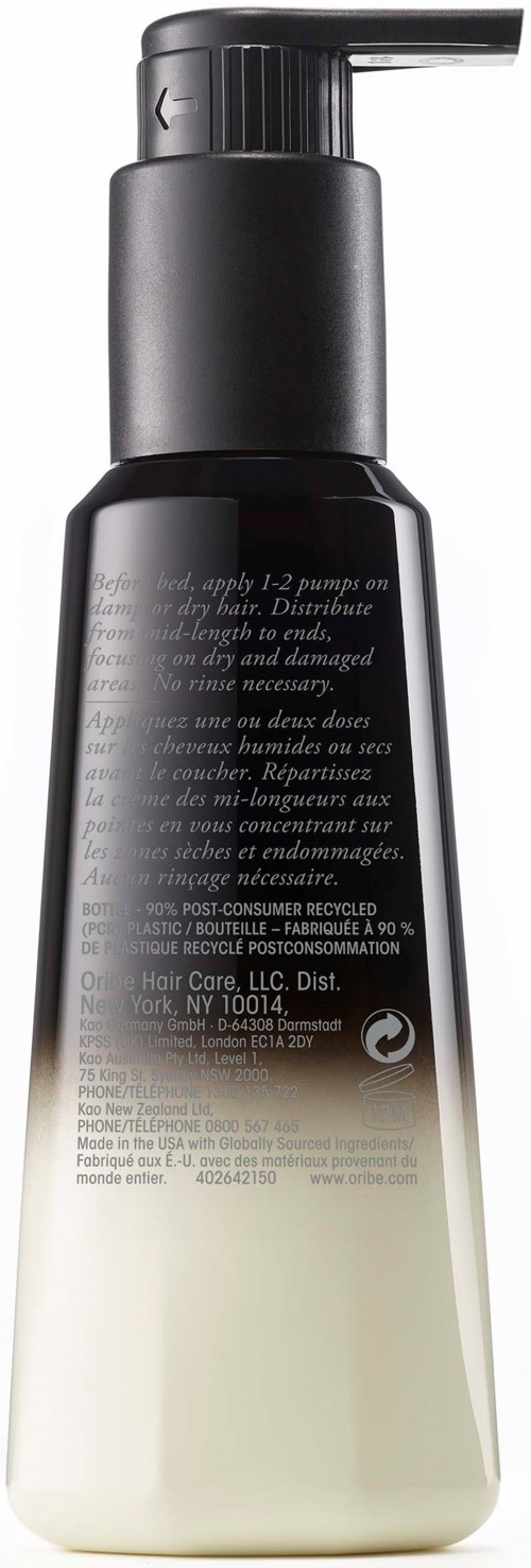 En svart och vit flaska med pump, troligen en tvållösare eller lotion.
