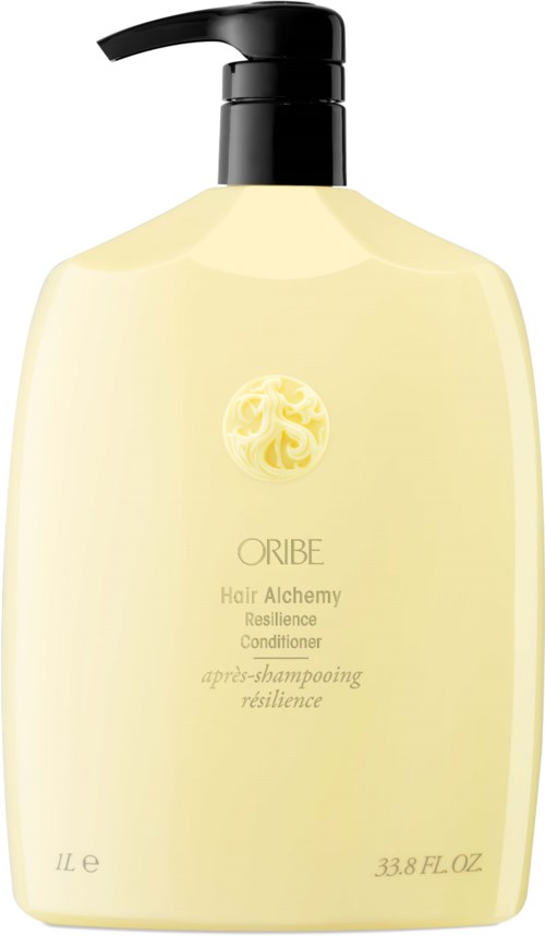 Vaalea keltainen pullo mustalla pumpulla, nimeltään Oribe Hair Alchemy Resilience Conditioner, 33,8 unssia.