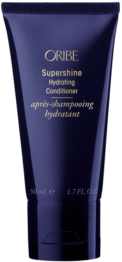 En mørk blå tube av Oribe SuperShine Hydrating Conditioner, 50 ml, laget for hårpleie.