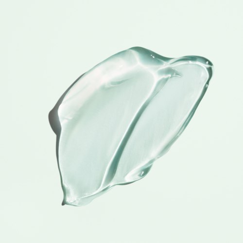 Et transparent, geléaktig stoff med en glatt, buet form og skinnende overflate.
