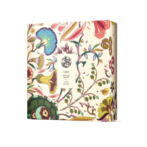 A floral patterned box with colorful, artistic flower and leaf designs, centered around a white label with a logo.