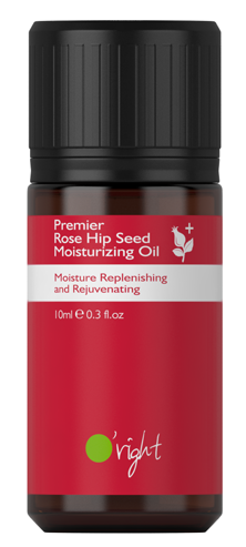 En liten mörk flaska med svart lock, etiketten säger 'Rose Hip Seed Moisturizing Oil,' 10 ml, och innehåller text och symboler.