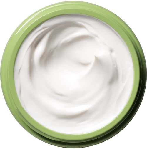 A green and white container filled with cream, showing a swirl on the surface.