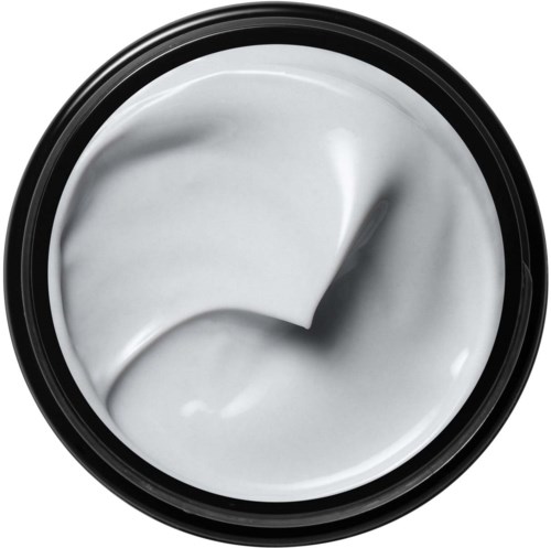 White cream inside a round container, with a small amount scooped out.