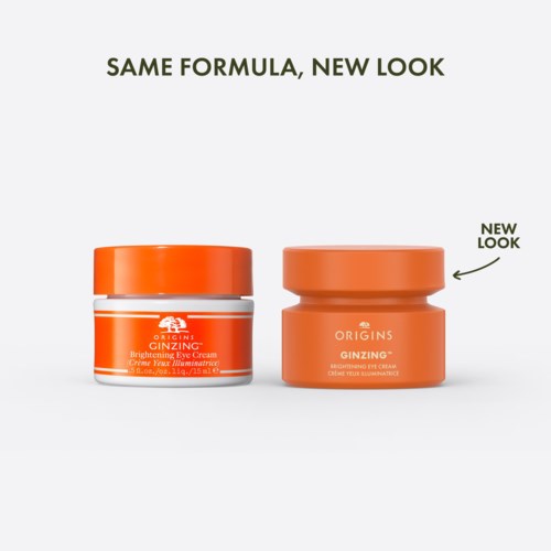 Två orange burkar med ögonkräm med ny design och enkel stil. Texten visar att de är för ljushet och hudvård.