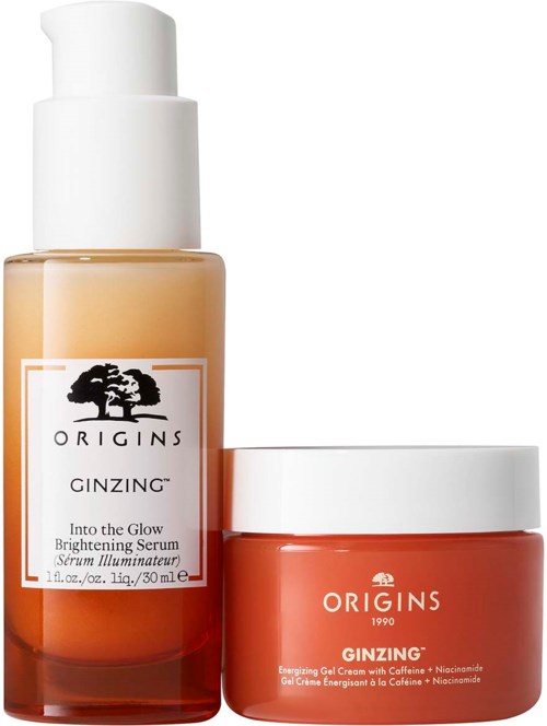 Two skincare products in bottles, one tall and white cap, the other small with a white lid, both orange.