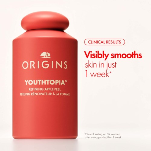 En rosa flaska med Origins Youthtopia äppelpeeling med text om hudutjämning på en vecka.