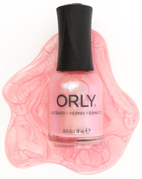 Pink nail polish bottle with black cap, laying on pinkish fluid background.