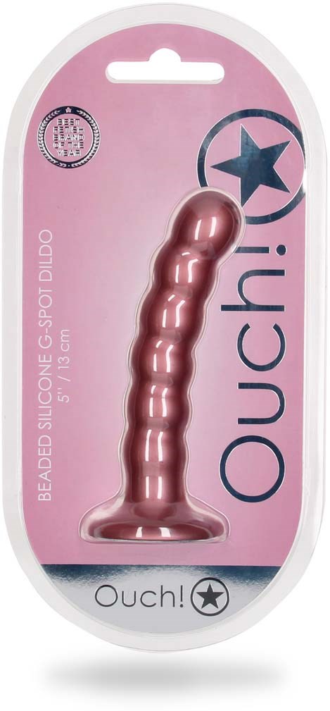 Różowy silikonowy dildo z teksturowanym, zakrzywionym kształtem, w różowym opakowaniu z niebieskim i czarnym tekstem oraz gwiazdkowym logo.