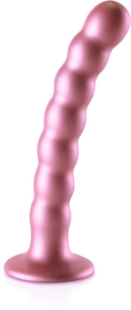 Väri-pinkki, penis-mäinen esine, jossa on useita pyöreitä nousuja, seisoo pystyasennossa tasaisella pohjalla.
