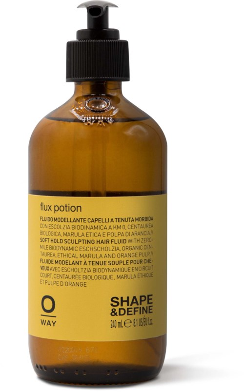 En brun flaska med svart pump innehåller Flux Potion, en hårvårdsprodukt, med gul etikett, svart text och en liten logga.