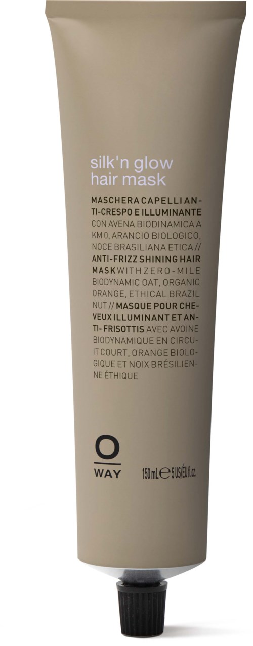 En beige tube med svart lokk, inneholder silk'n glow hårmaske; teksten beskriver ingredienser og formål for sunt hår.