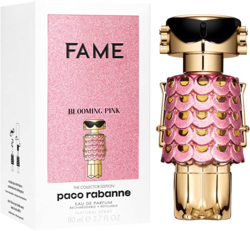 Ein Parfümflakon in Robot-Design, pink und gold Dekorationen, mit pinkem Karton mit schwarzem und pinkem Text.