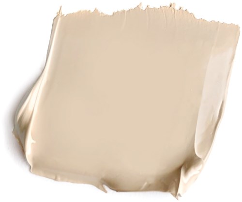 Ett beige stycke av rå stärkelse, verkar som ett trasigt ark eller skiva.