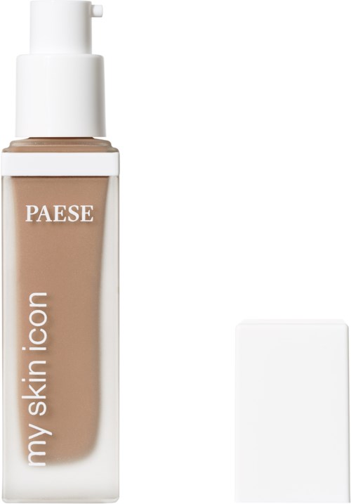 Beige nesteväriä sisältävä pullo pumppulla ja valkoinen neliön muotoinen korkki.