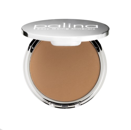 Ett runt compact med beige puder och ett vitt lock med svart text.