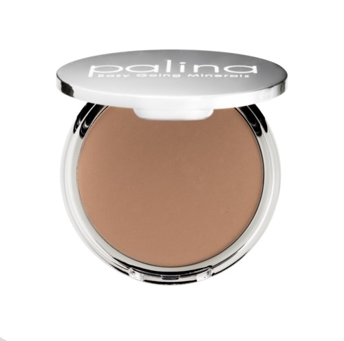 En kompakt av foundation med ett silverlock, med beige makeup inuti.