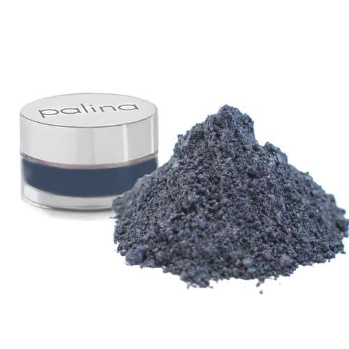 Kleiner Behälter mit der Aufschrift 'palina' neben einem Haufen dunkler grauer Pulver.