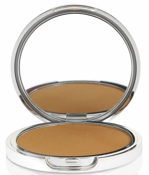 En rund make-up- eller ansiktspuder med spegel öppen.