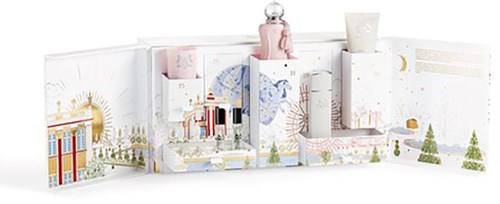 A white paper fold-out with colorful illustrations, small products, and decorative items displayed inside.