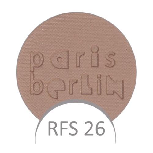 Okrągła brązowa tabletka z napiskami "paris berlin" i "RFS 26".