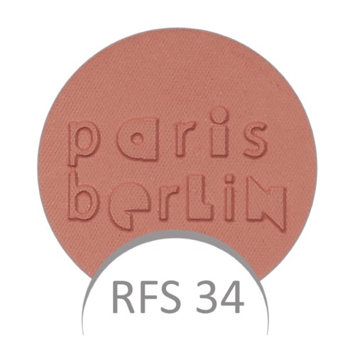 Okrągły, różowy róż do makijażu z wypukłym napisem 'paris berlin' oraz 'RFS 34' napisanym poniżej.
