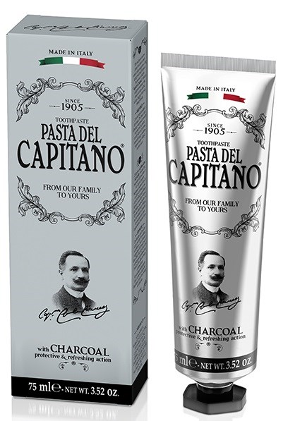 Tandpastút met zwart-wit ontwerp, een portret van een man en een groen en rood "Made in Italy" label.