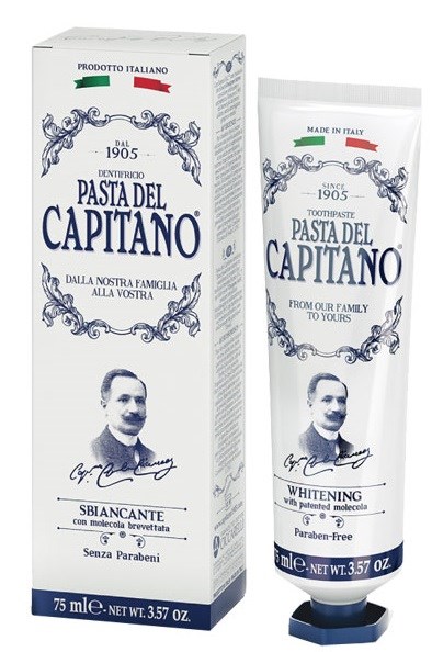 A box and tube of toothpaste named Pasta del Capitan, with Italian flags, a man's portrait, and labels for whitening and paraben-free.