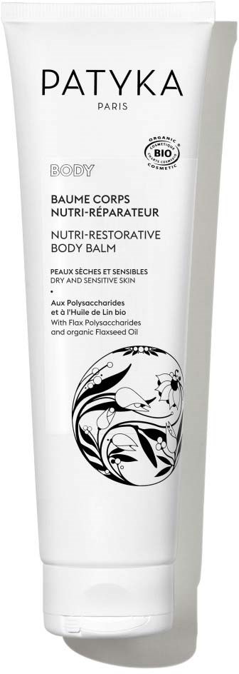 En vit tub med Patyka body balm med svart text och svartvitt blommönster.