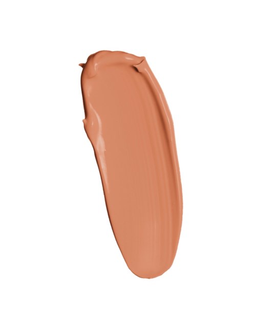 Ett streck av beige eller ljusbrun makeup eller kräm på en vit bakgrund.