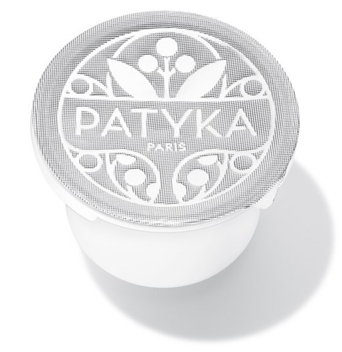 Locket har en blommig design med ordet 'PATYKA' i mitten, och en rund form med dekorativa mönster.