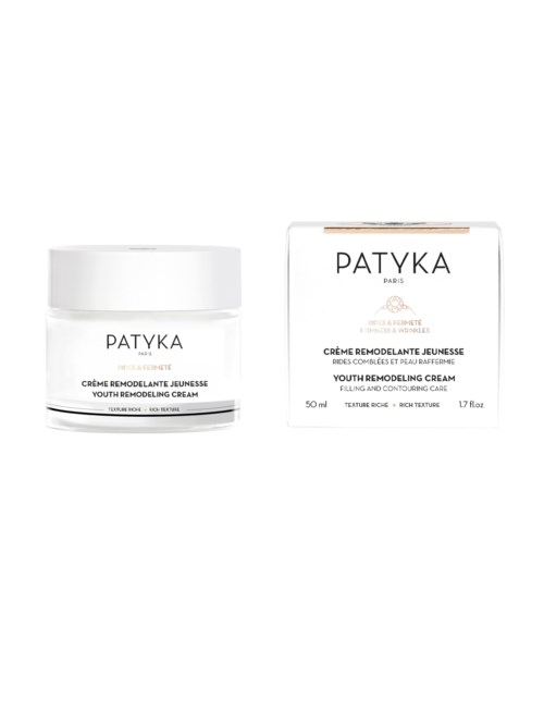 En ungdomsremodeleringskrämburk och dess låda, båda vita med svart och guld text, märkt 'PATYKA Paris'.