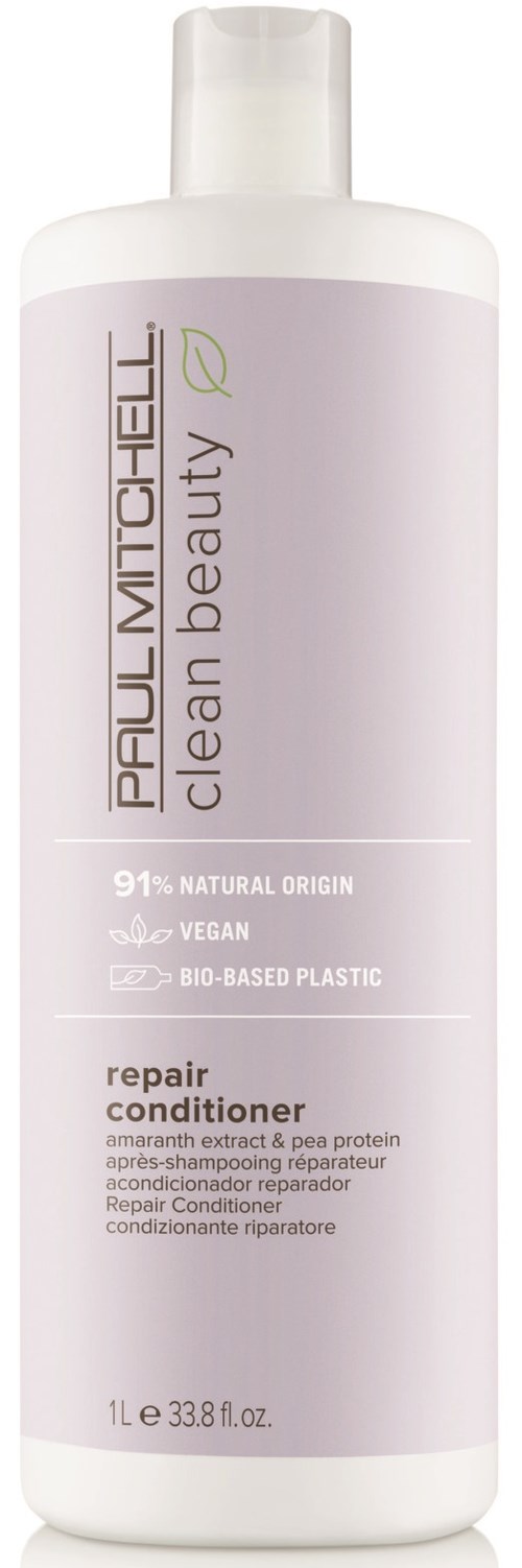 Eine weiße Flasche von Paul Mitchell Clean Beauty Reparaturconditioner mit Text über natürliche Inhaltsstoffe und vegane, umweltfreundliche Aussagen.