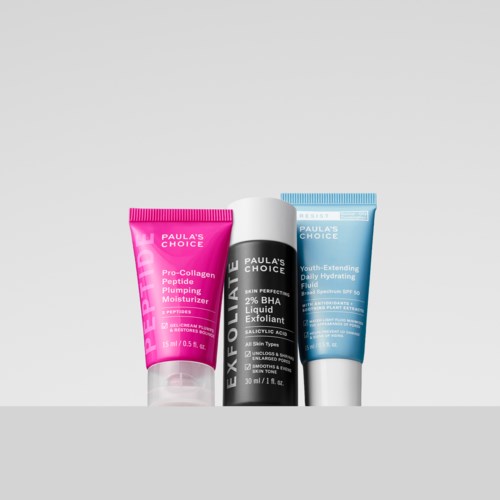 Three skincare products from Paula's Choice: a pink Pro-Collagen moisturizer, a black exfoliant, and a blue hydrating fluid.