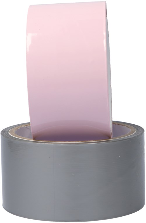 Een roze tape staat rechtop in een grijze tape-dispenser.