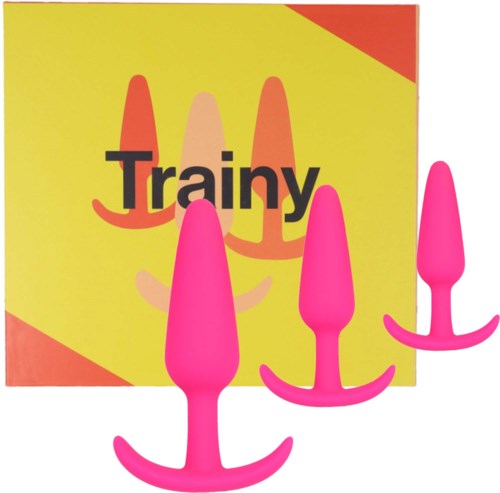 A box with the word "Trainy" and three pink butt plugs in front of it.