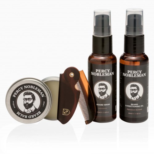 Ett grooming-set med skäggtvätt, vårdande olja, en liten burk och kam. Alla produkter är märkta Percy Nobleman.