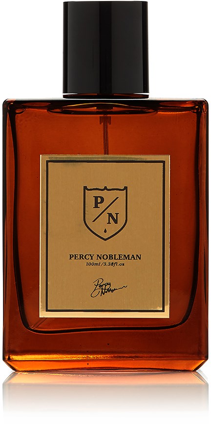 En brun parfymflaska med svart lock och beige etikett, märkt Percy Nobleman, 100 ml.