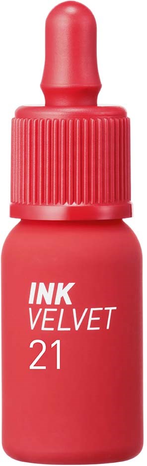 En liten röd flaska med droppkork och vit text som säger 'INK VELVET 21'.