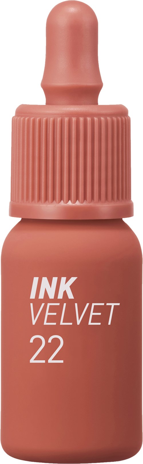 En liten rosa flaska med en pipettlock, märkt INK VELVET 22.