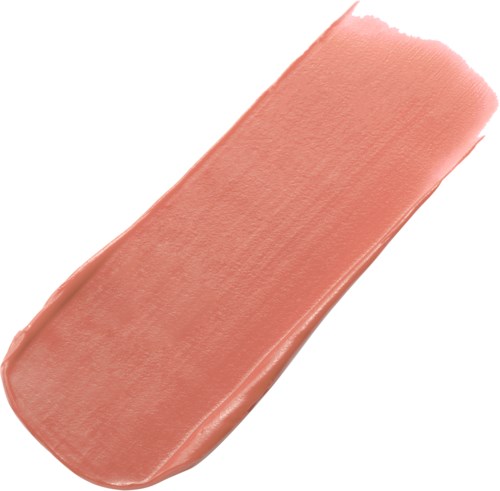 En färgprov av persikofärgad makeup eller foundation med en slät, lite glansig yta.