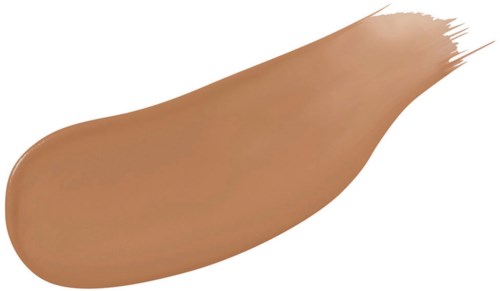 En smet av beige foundation med ojämnt kant och streaks.