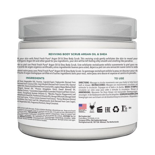 A jar labeled 'Reviving Body Scrub Argan Oil & Shea' with ingredients and usage instructions, mainly white and gray.