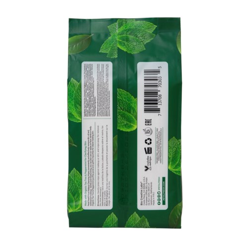 Green packaging with leaf patterns, contains text, barcode, and recycling symbols, likely a tea or herbal product.